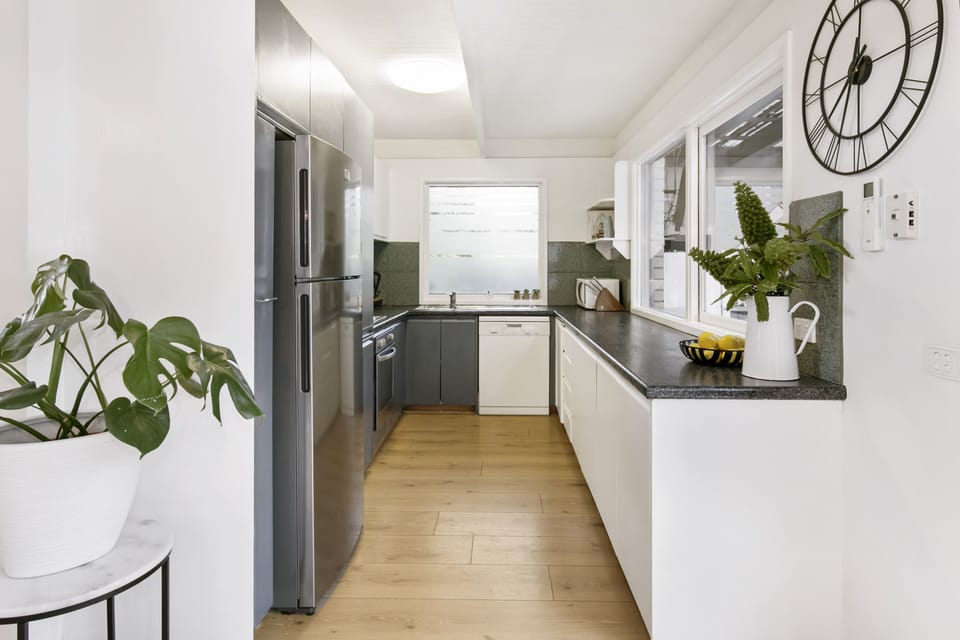 Newly refurbished kitchen with new stovetop, oven and a new fridge
