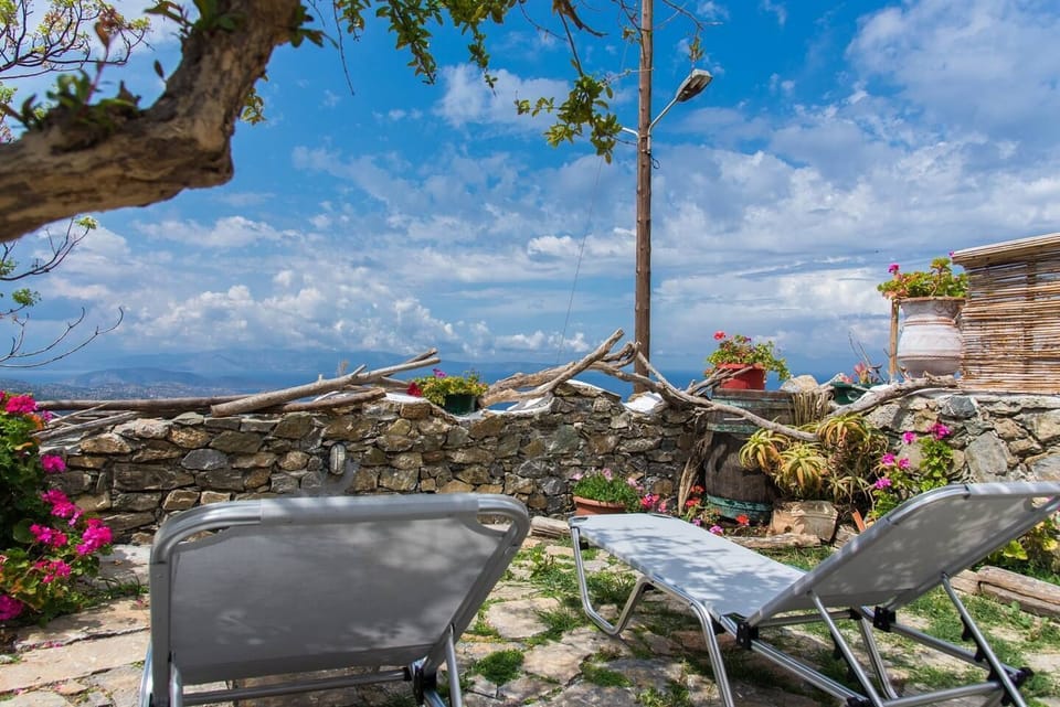 The terrace. The perfect place to eat, read or just relax and enjoy the lovely sea views next to the pomegranate tree
