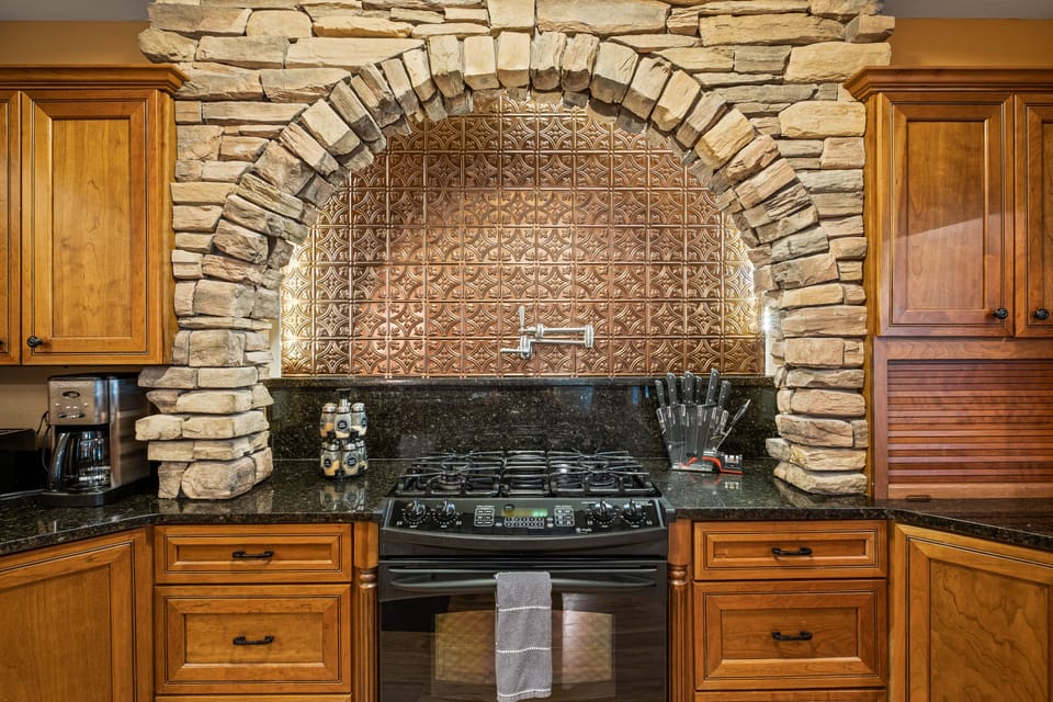 Stove area with pot filler.