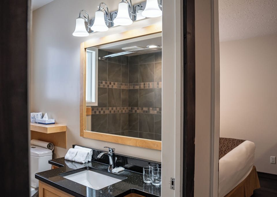 Family Suite, Multiple Beds, Non Smoking | Bathroom | Combined shower/tub, hair dryer, towels, soap