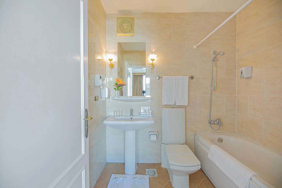 Bathtub, deep soaking tub, hair dryer, towels