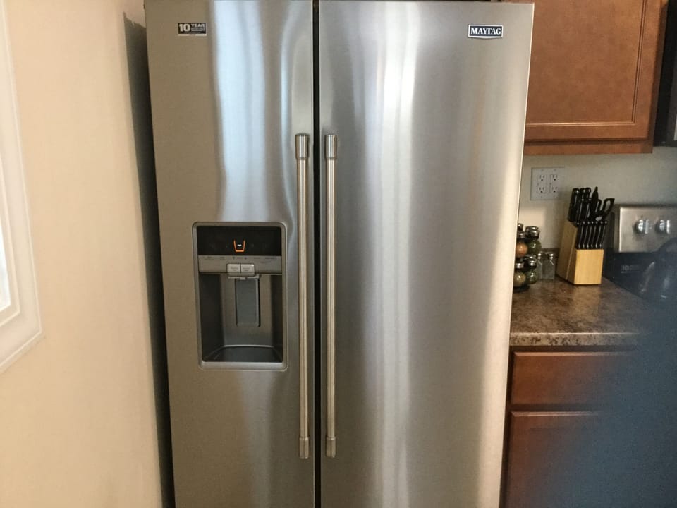 Stainless steel family sized fridge with water and ice dispenser