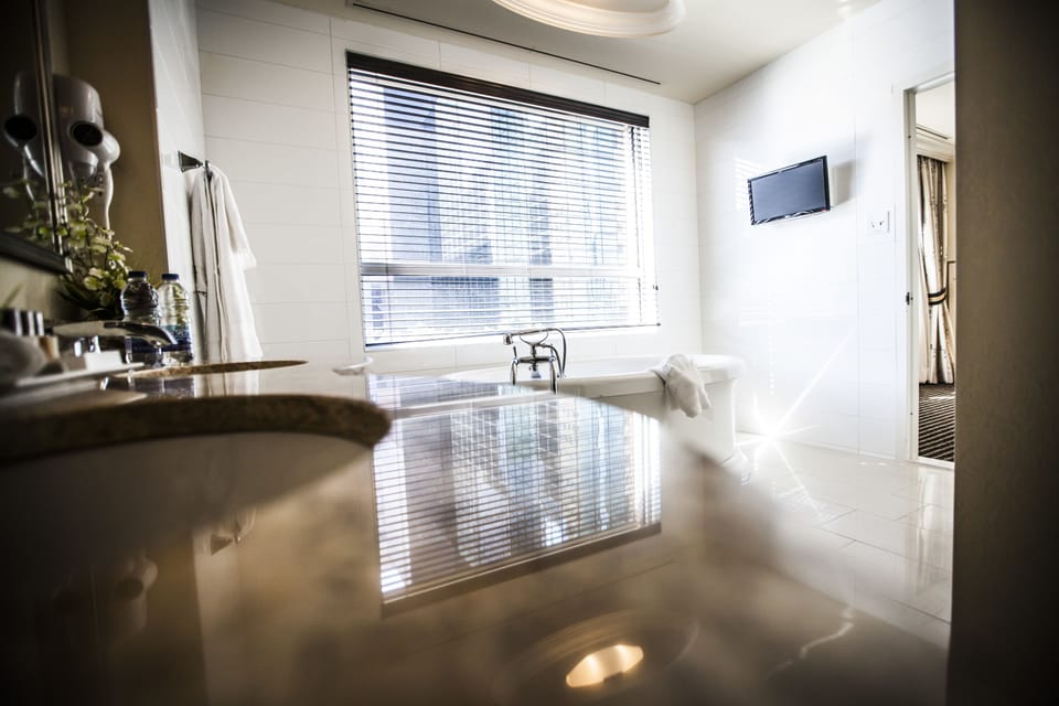 Shower, designer toiletries, hair dryer, bathrobes
