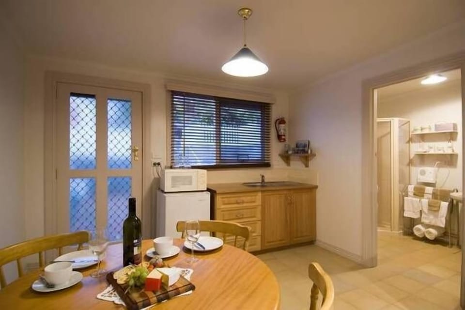 The well equipped kitchenette with full size dining table.