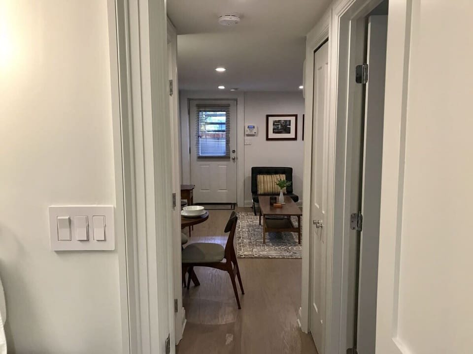Hallway connecting bedrooms to living space 