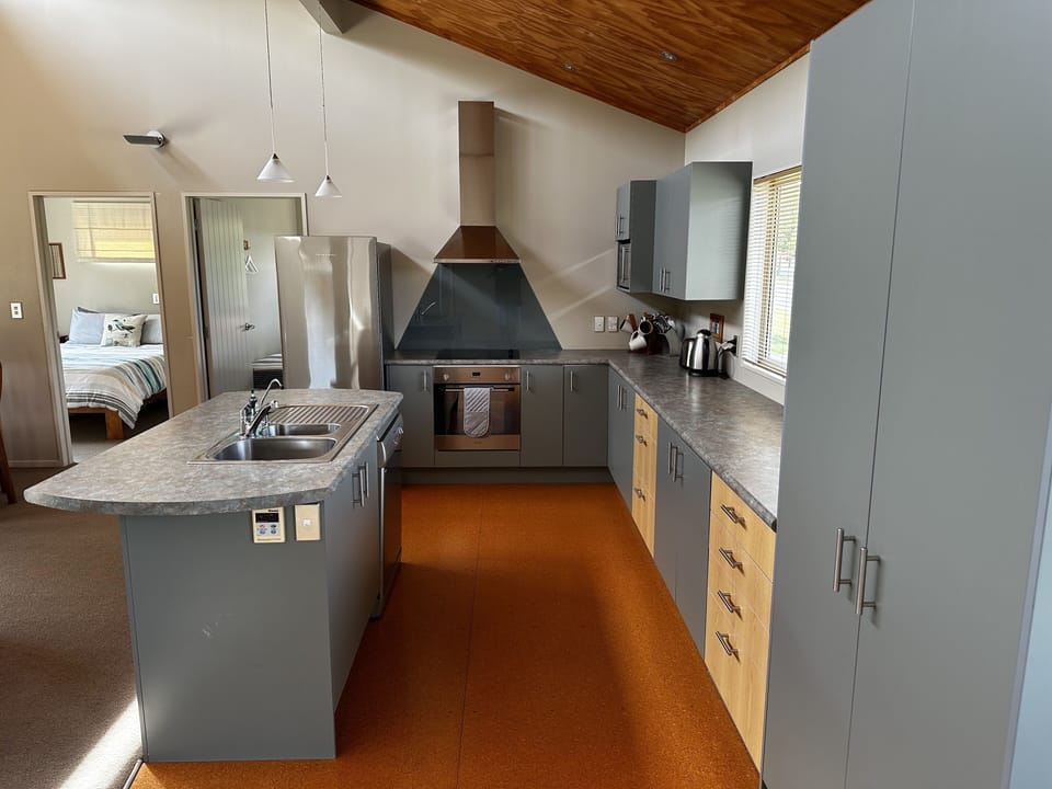 Large modern kitchen including dishwasher and full sized fridge