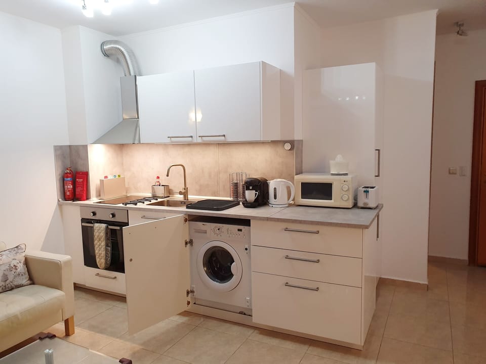 New kitchen fully functional kitchen with washing machine.