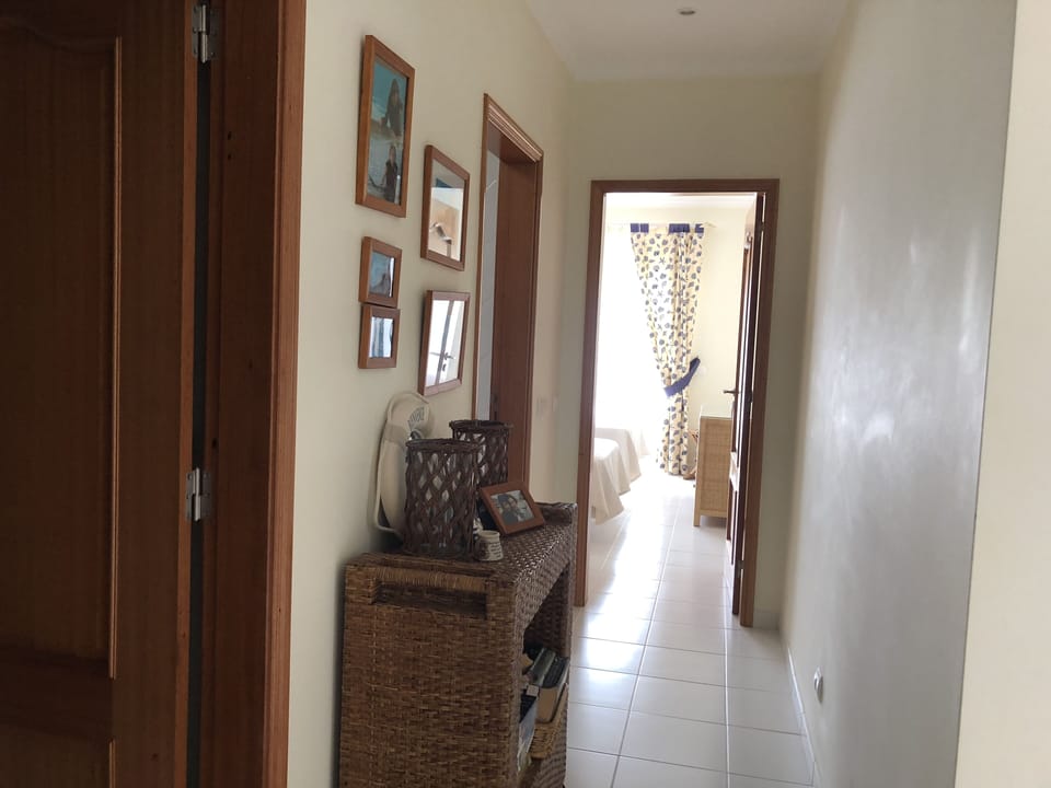 The bathroom is in between the 2nd and the 3rd bedroom.