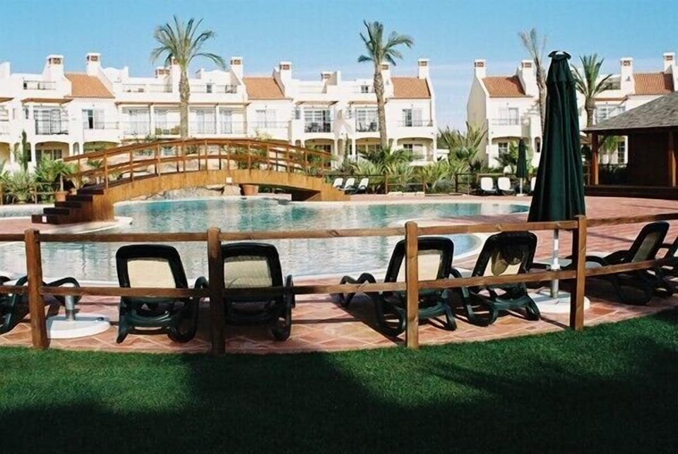 View to pool from apartment porch. 1 minute away . Best location in phase 1 