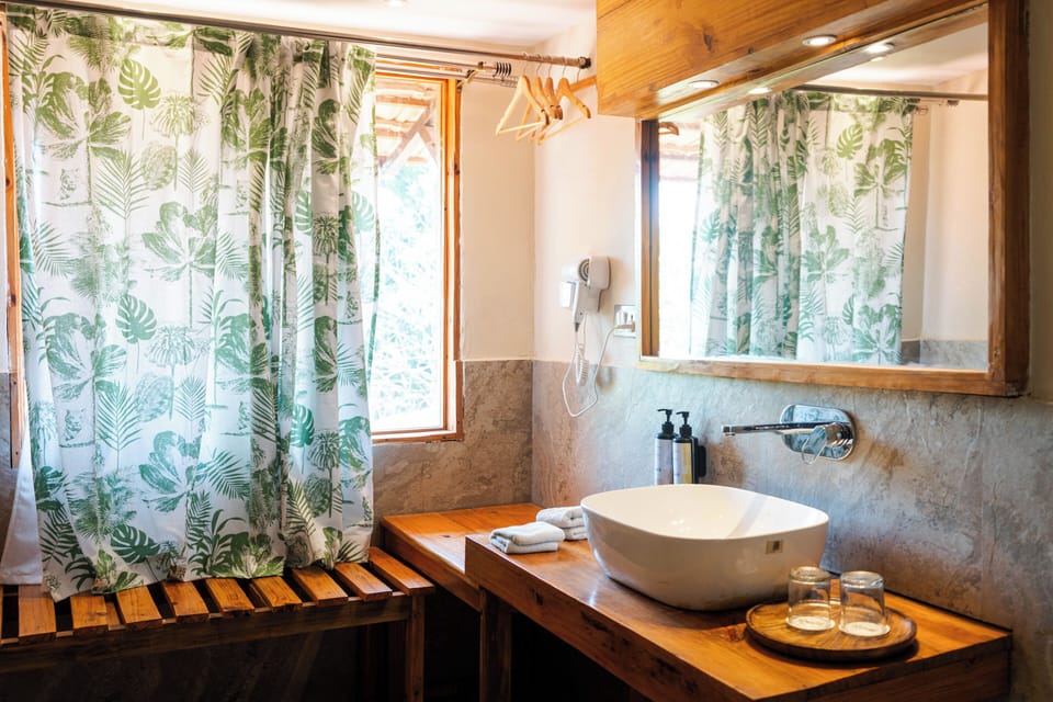 Family Suite, Multiple Beds, Smoking, River View | Bathroom | Shower, slippers, towels