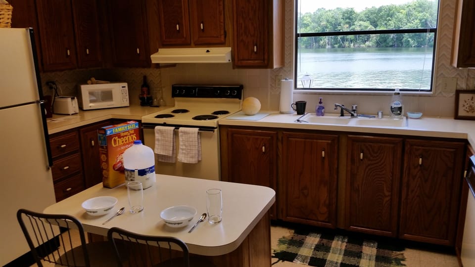 Kitchen is fully stocked with all appliances and utensils.