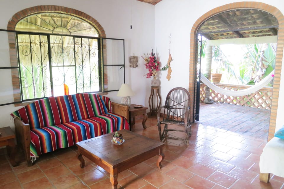 The living room giving on to the porch