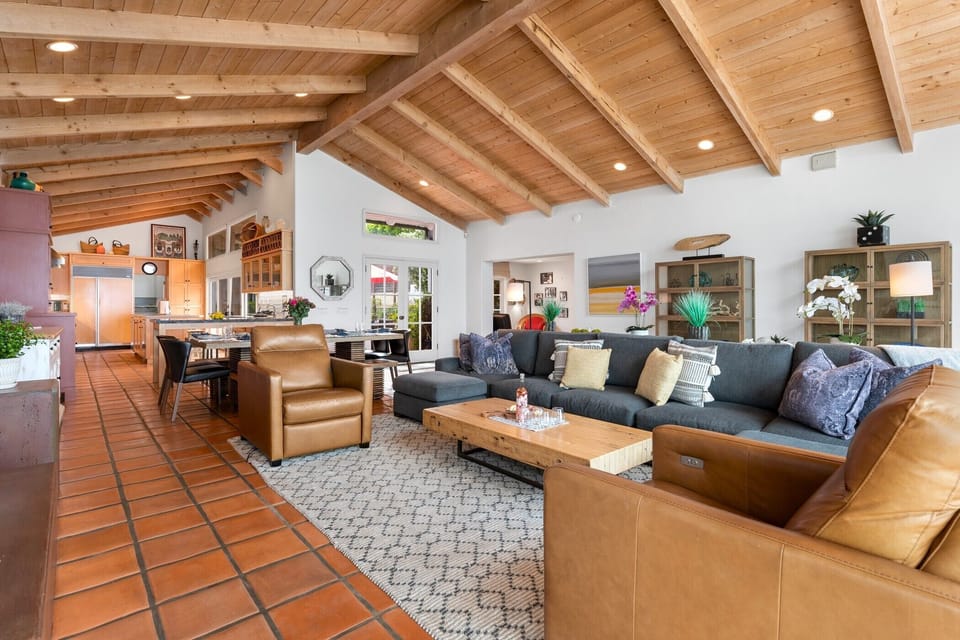 Living area towards kitchen and dining