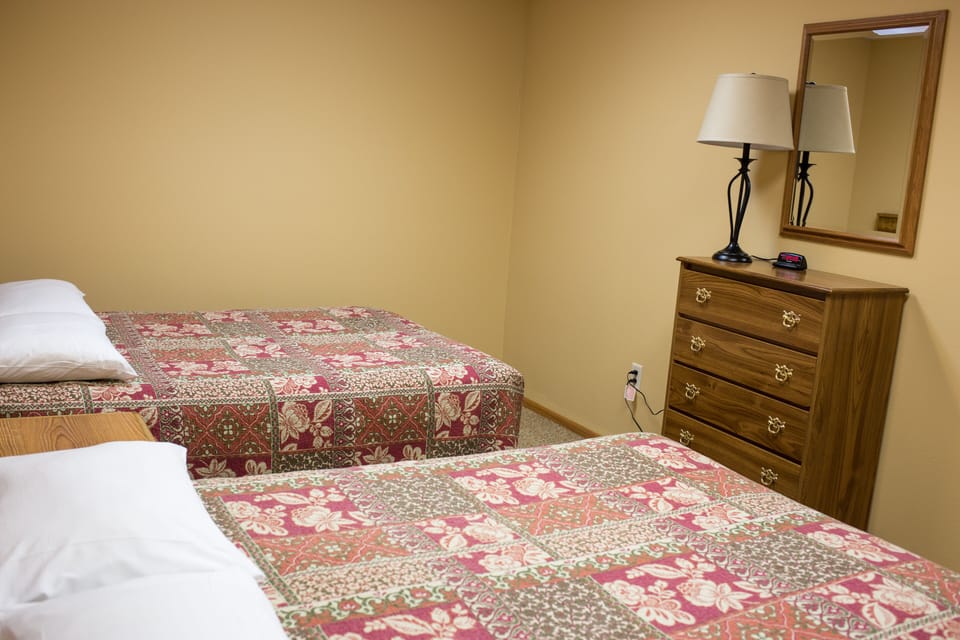 Bedroom downstairs with two full beds