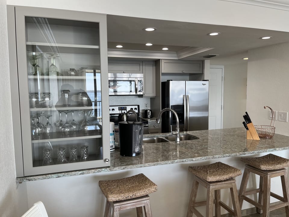 Kitchen fully renovated (January 2023) with glass  cabinet and counter seating 