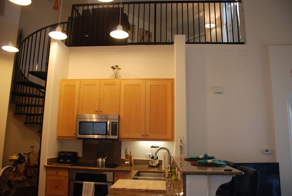 Kitchen looking up to loft area.