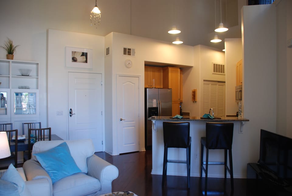 Front door and kitchen bar area.