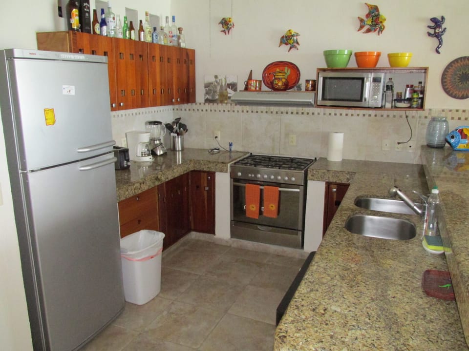 full kitchens on both sides with stainless steel appliances