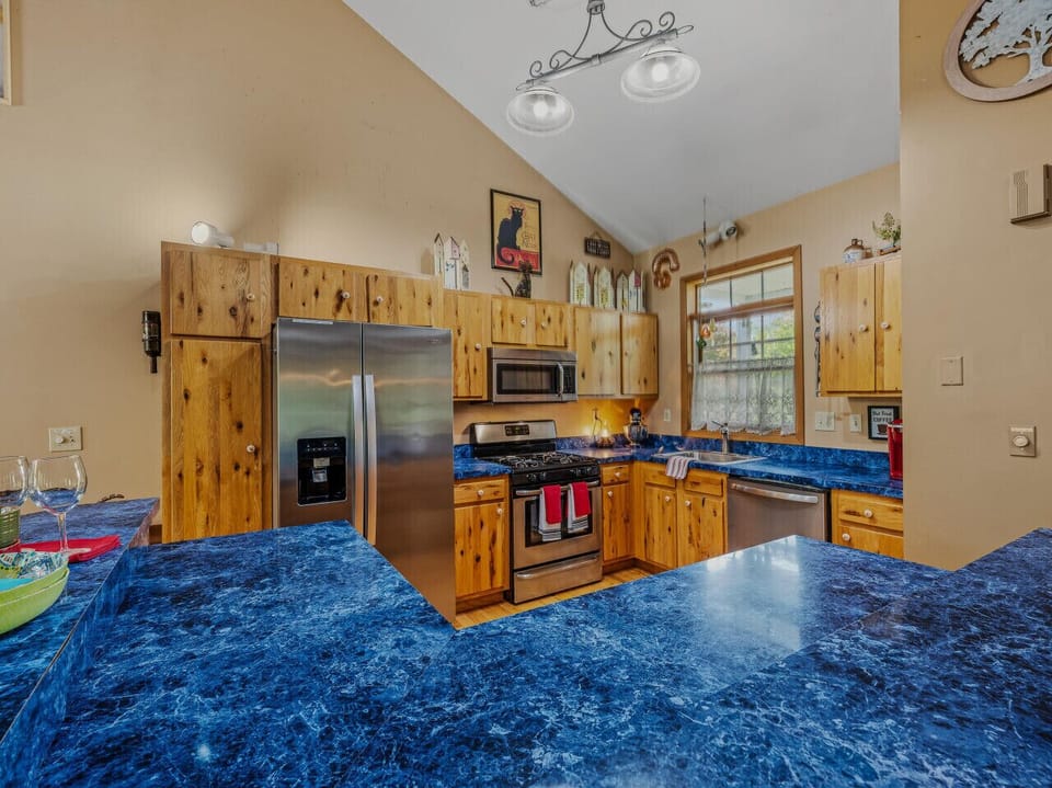 Well appointed kitchen for cozy coffee or family feasts! Note the Dishwasher, microwave, oven, and water dispenser.