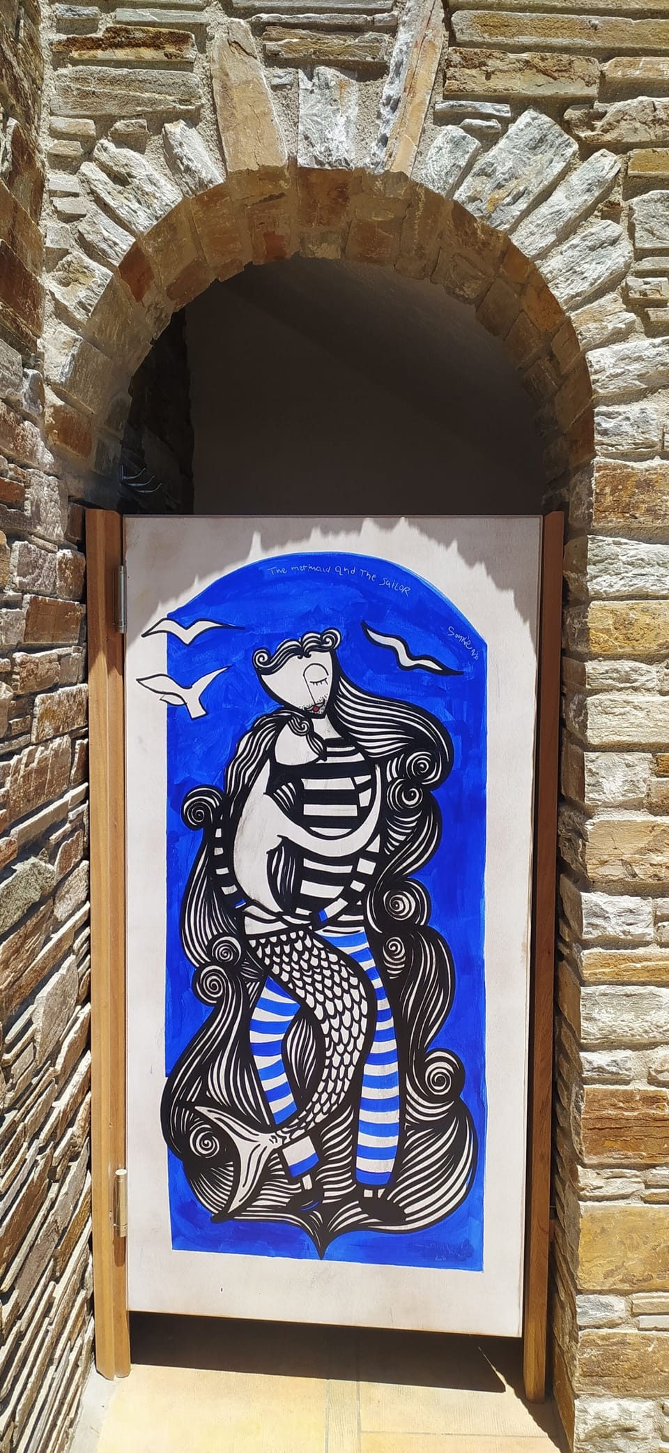 Outdoor shower art: "The Mermaid & the Sailor" by Greek artist Sonke. 