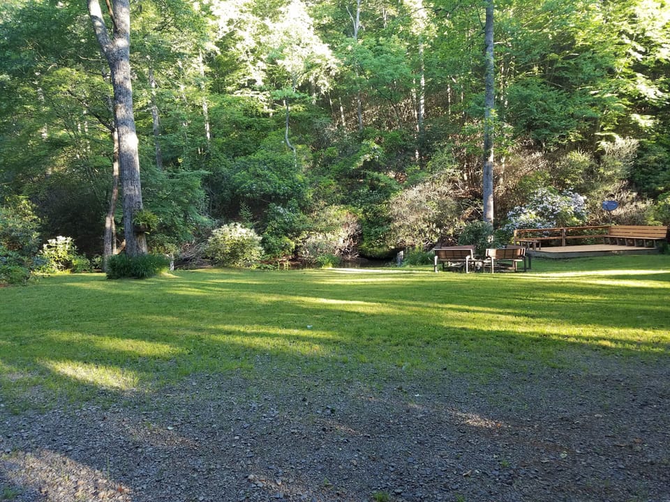 Open grassy area for campfires and another deck for stream watching