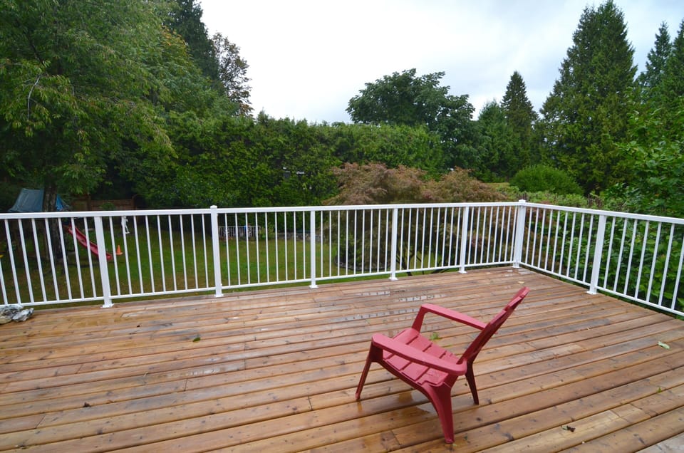 Private deck overlooking backyard