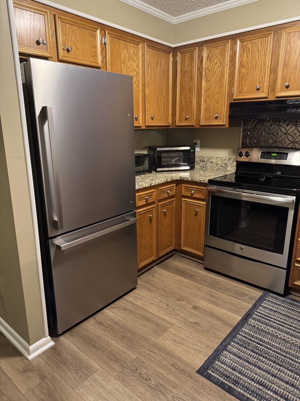 Refrigerator, microwave, toaster and toaster oven. 