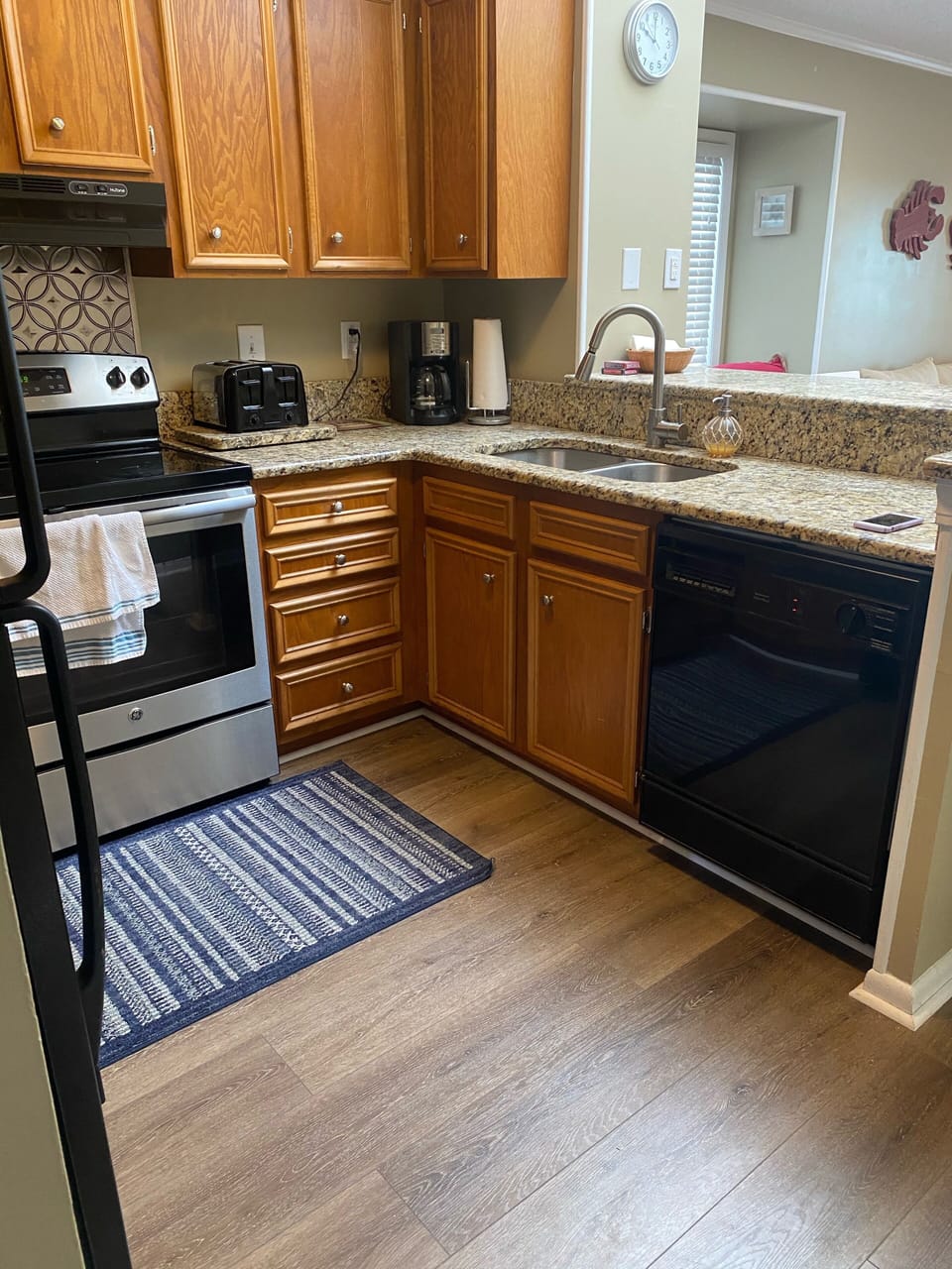 Kitchen- coffee maker, dishwasher and stove.
