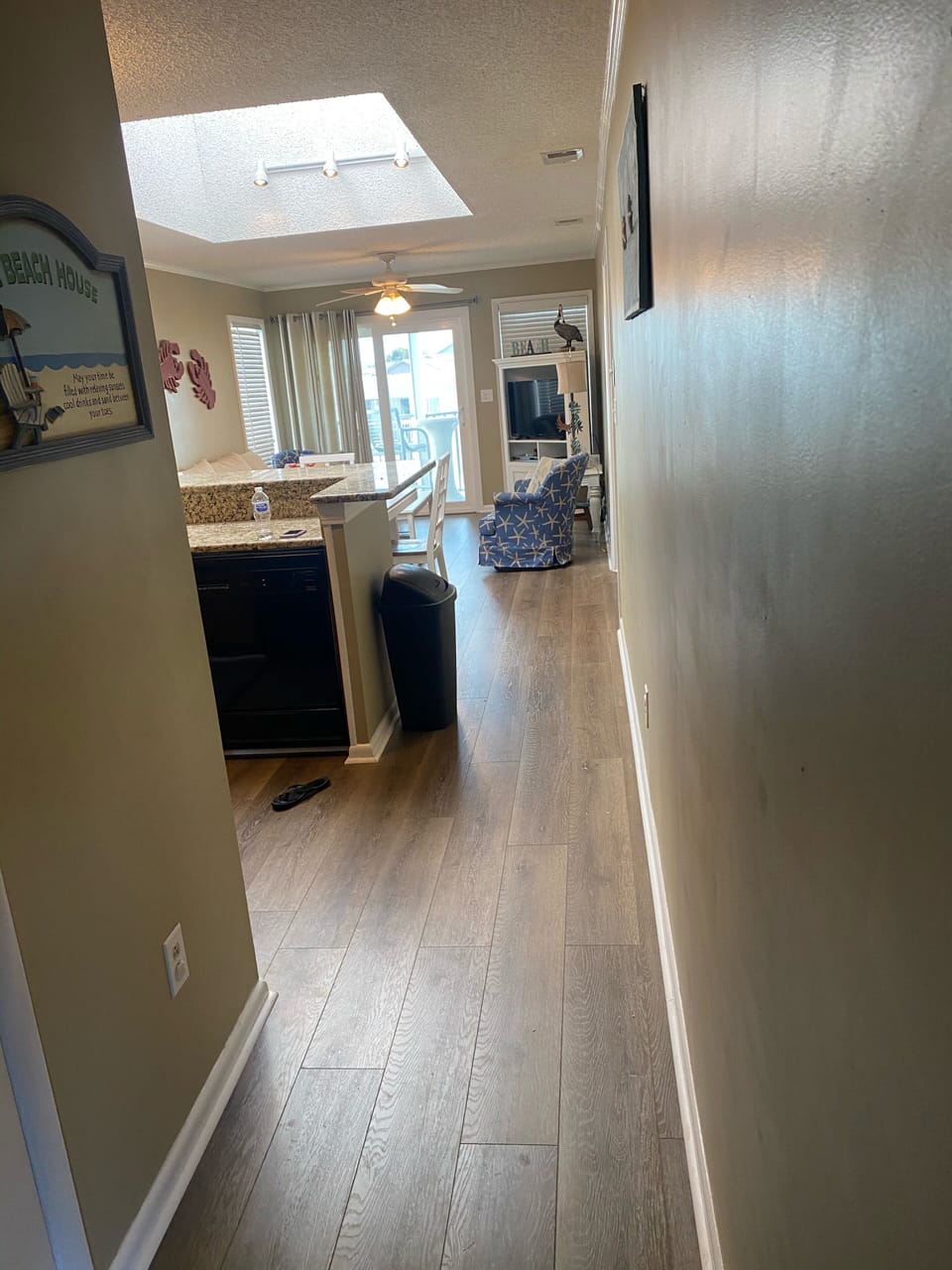 View into condo from the front door featuring the large skylight.  