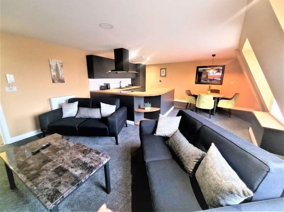 Two Bedroom Apartment | Living area | 40-inch flat-screen TV with digital channels, TV
