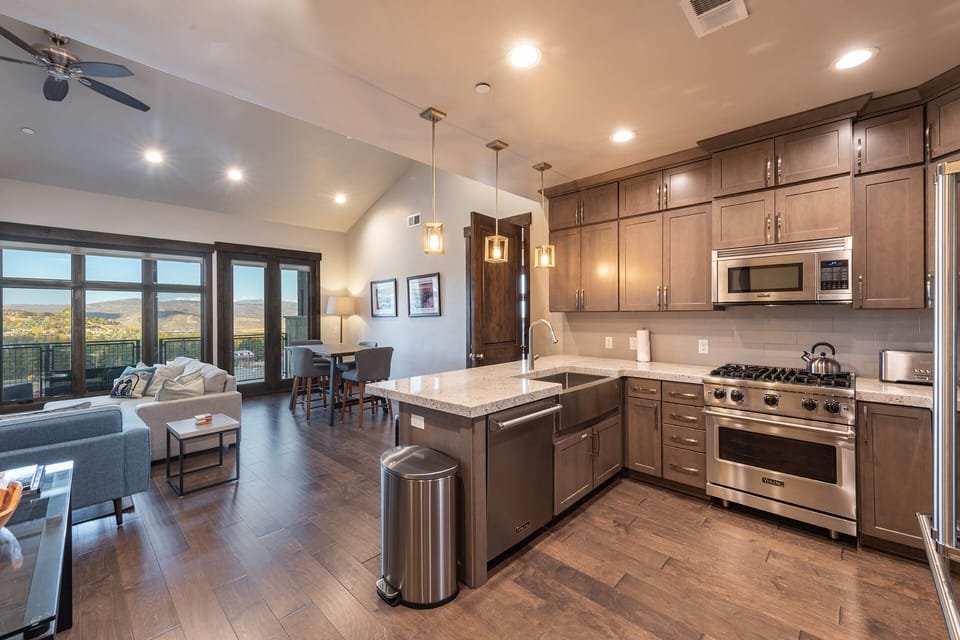 Deluxe Condo | Living area | 45-inch flat-screen TV with cable channels, TV, Netflix