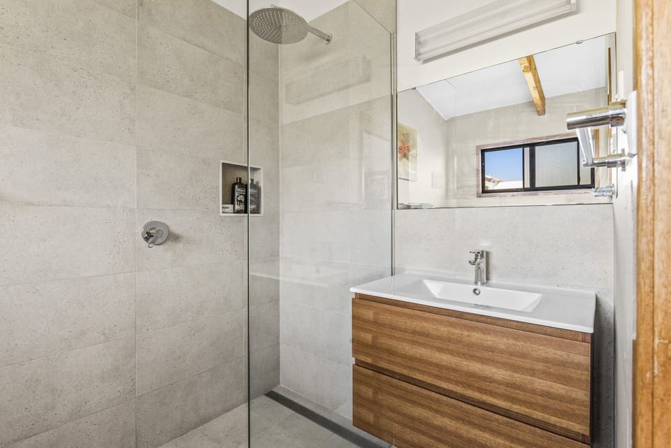 Bathroom with rain shower & shampoo