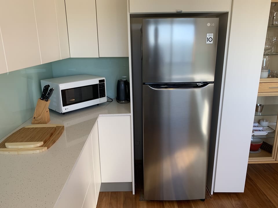 Fully equipped kitchen with microwave and new fridge