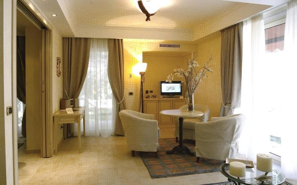 Superior Suite, Private Pool | Living area | LCD TV