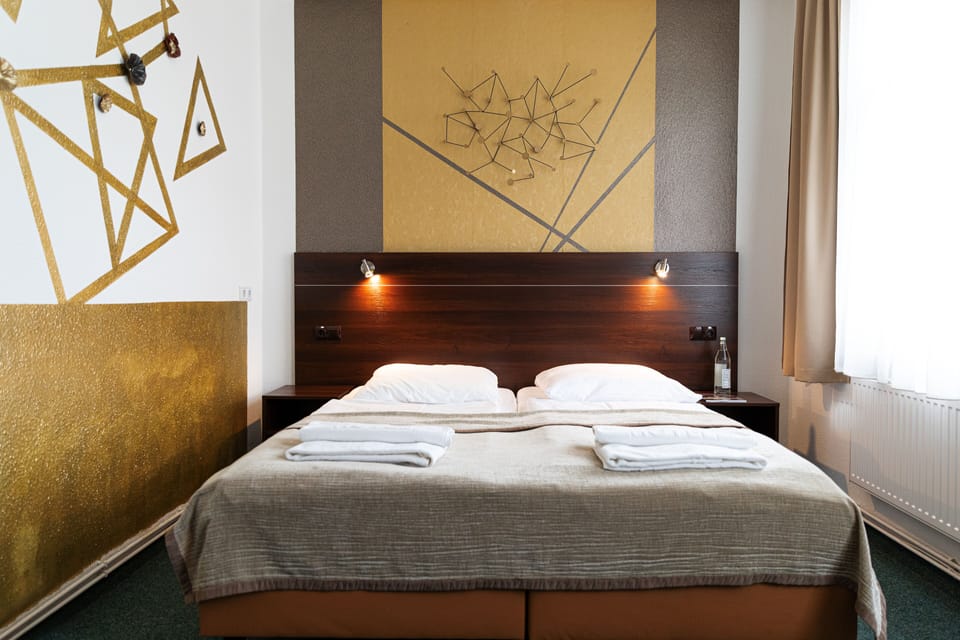 Basic Double Room | Living area | 82-cm flat-screen TV with satellite channels, TV