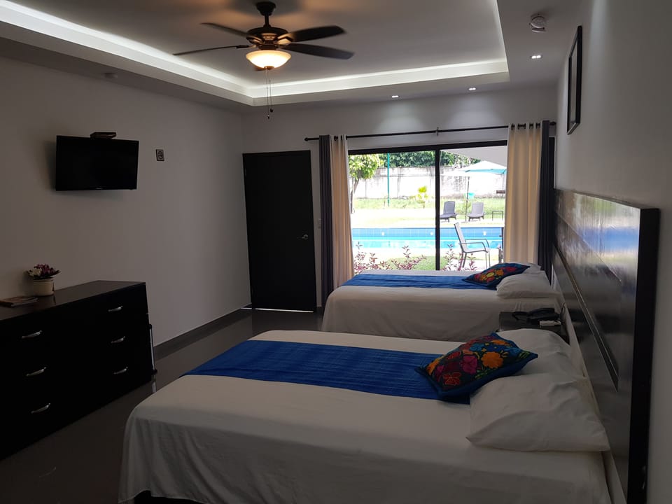 Family Double Room, 2 Double Beds, Accessible, Pool View | 12 bedrooms, in-room safe, WiFi (free), individually decorated