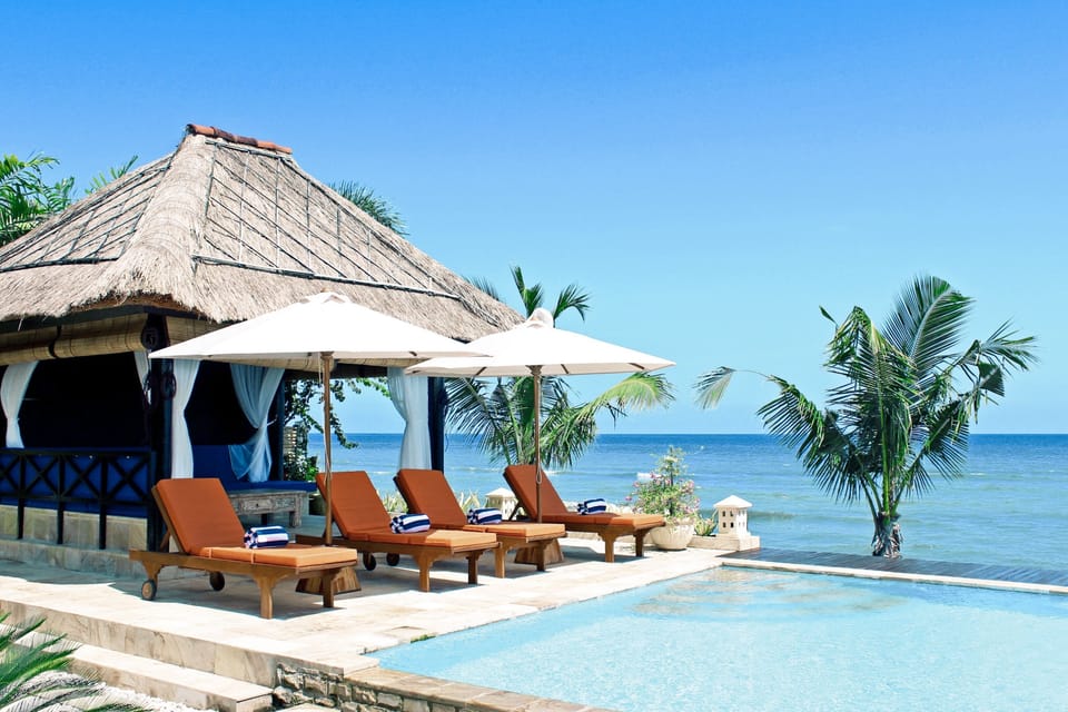 Relax by the Bali Sea or take a dip in the infinity pool.