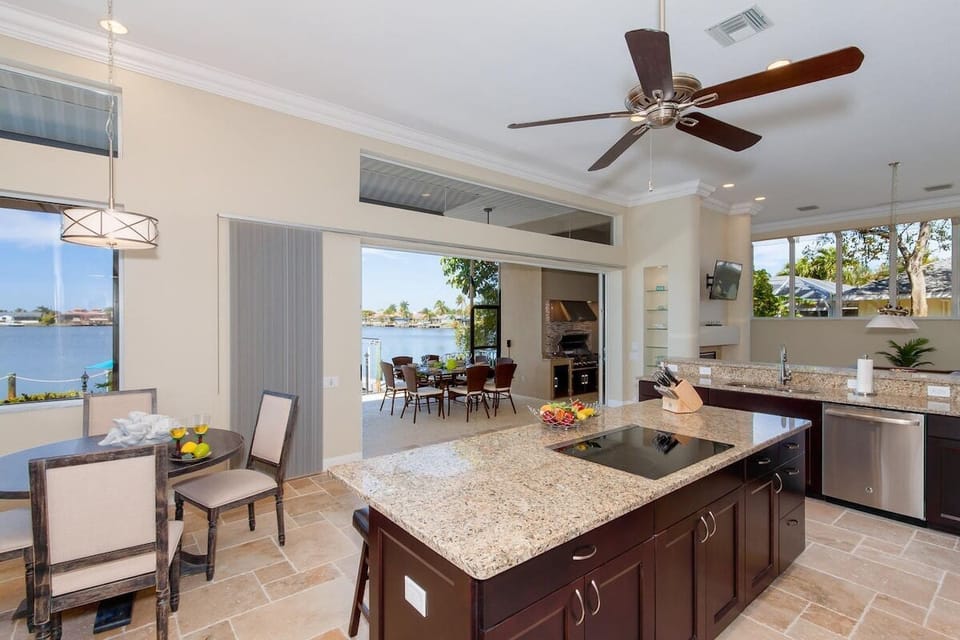 Large Kitchen with Center Island and Nook Area for Dining with View of the Lanai and Pool