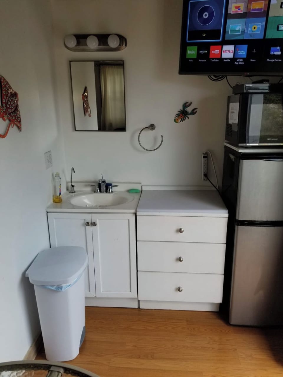 Basic kitchen ware is in the drawers between sink and refrigerator/freezer. 
