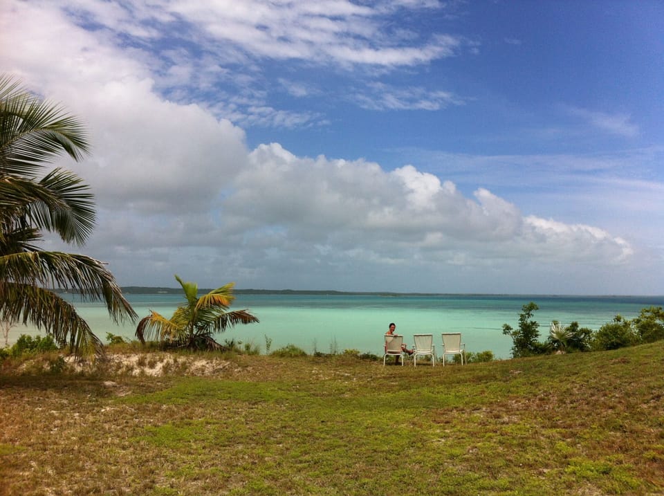 Take a chair to the edge of the Bluff for stunning bay and sunset views