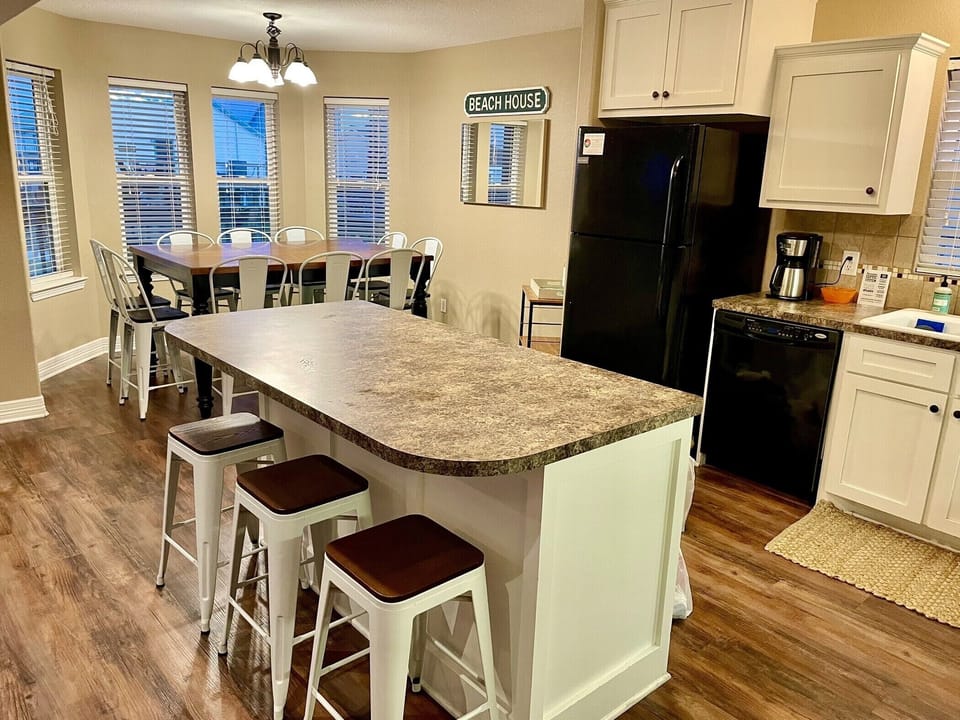 Seating for 10 at the dining table and 3 at the kitchen island