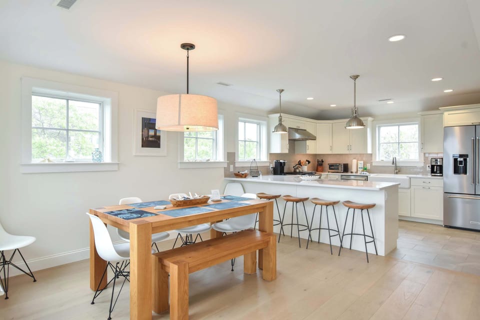 dining room and kitchen area. Seating at kitchen breakfast bar