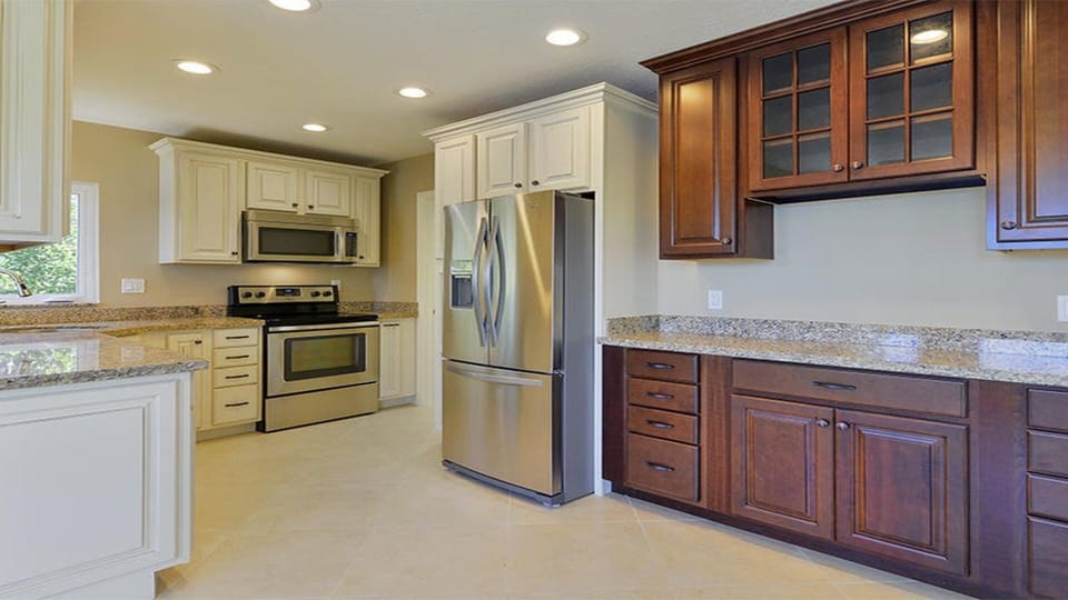 Kitchen with SS appliances (microwave, dishwasher, oven, stove & refrigerator).