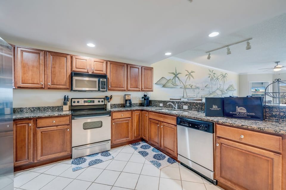 Gourmet Kitchen with Granite, Custom Tile, & Stainless Steel Appliances.
