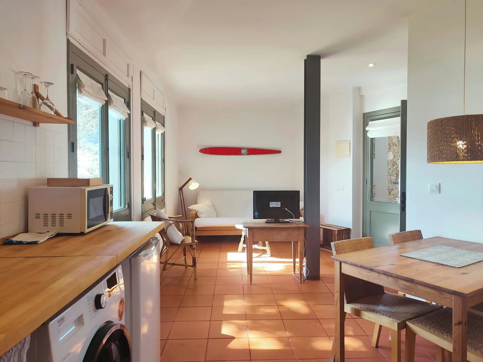 The open kitchen seamlessly connects to the living area, creating a spacious flow where you can cook and relax together.
