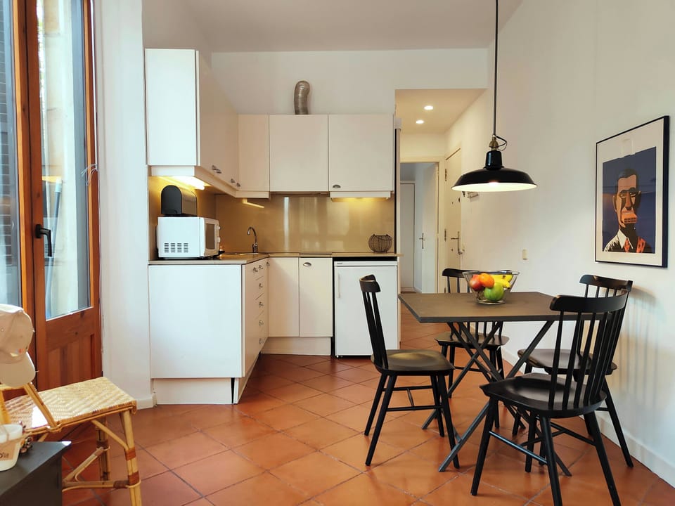 Dining and living areas fully integrated in an open layout.