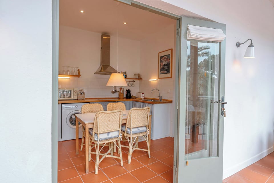 A bright, open-concept kitchen facing the balcony — seamlessly integrated with the living room for a modern, airy feel. Perfect for cooking and enjoying the view!