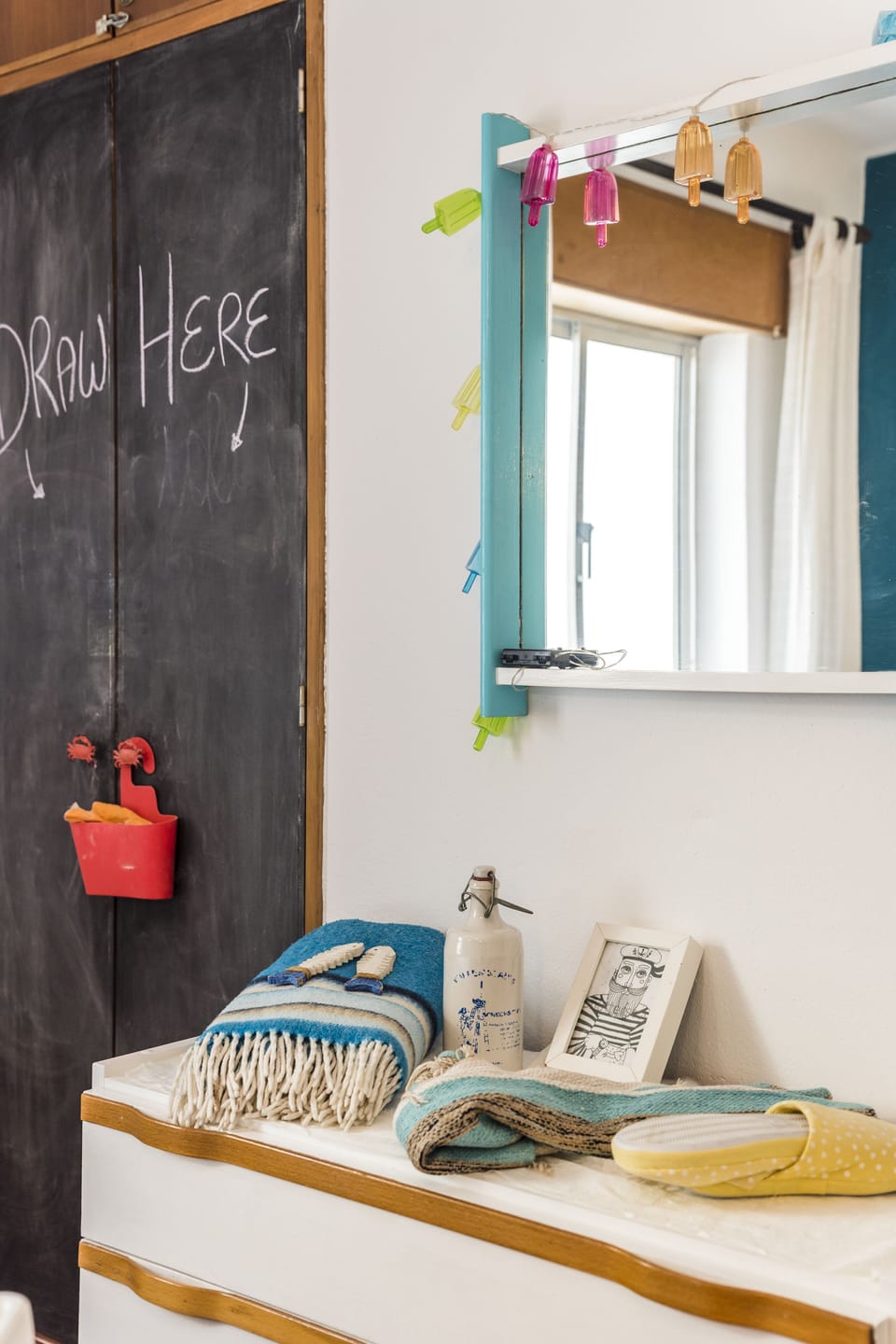 The twin room wardrobe is a giant chalkboad for them to doodle on again & again