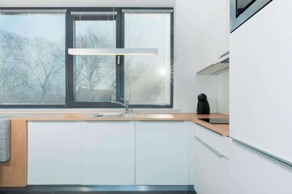 The kitchen is fully equipped, bright and elegant. The place will certainly facilitate longer stays.