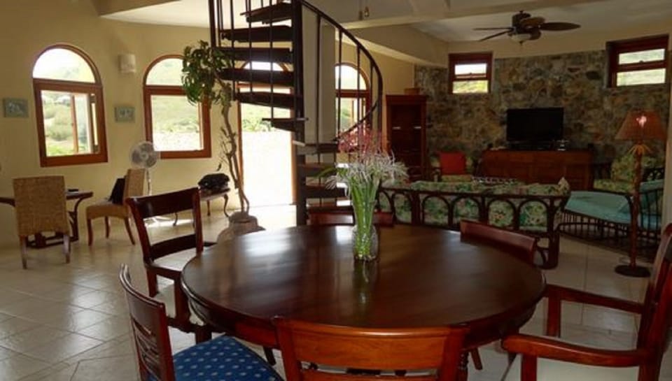 Looking from dining room to front entrance and main living area
